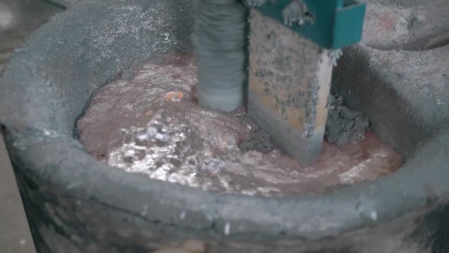 molten metal poured in sand molding and aluminum alloy casting, red hot metal