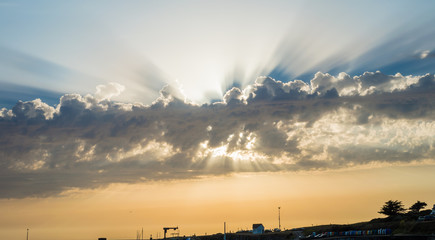 The rays of the Sun from behind the clouds