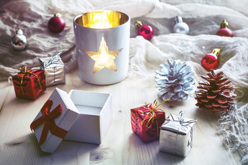 White Lantern With Xmas Decoration With A Scarf In Background