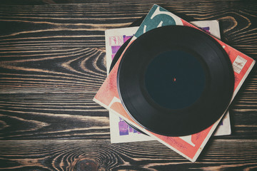 old vinyl record on the wooden table