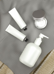 Cosmetic packaging spa set on fabirc and wood table organic feel
