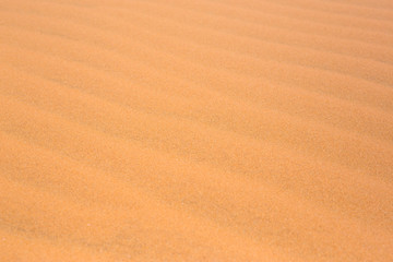 Fototapeta na wymiar red Desert sand dunes texture pattern