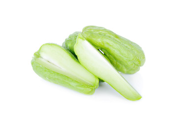 fresh unpeeled chayote on white background