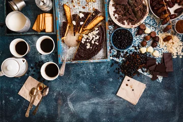 Gordijnen Tarta de santiago, spanish almond cake with coffee and chocolate bonbon over party table.  © casanisa