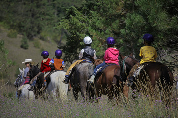 kids riding horses