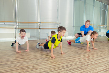 Fototapeta na wymiar Happy sporty children in gym.