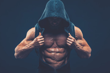 Man with muscular torso. Strong Athletic Men Fitness Model