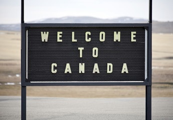 A welcome to Canada sign at the Canadian border.