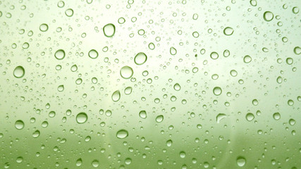 Plakat Close-up of water drops on glass surface as background