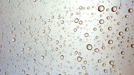 Close-up of water drops on glass surface as background