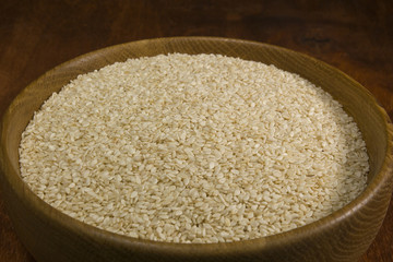 Sesame seeds in a wooden bowl