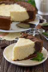 Cake with cream cheese and chocolate cheesecake on a table in a