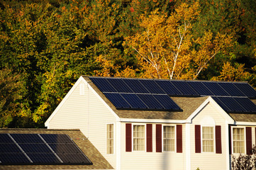solar panel installed on the house roof with autumn trees