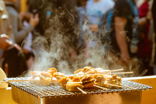 scallop (hotate) and sea ​​urchin eggs (uni) skewer grill with smoke, japan