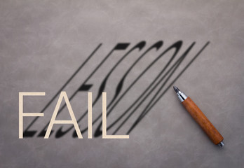 wooden pencil with fail word and lesson word