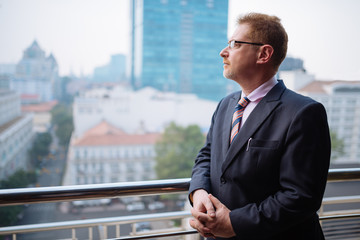 Businessman on balcony