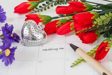 Reminder Wedding day in calendar with pen