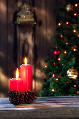 close up view of two red candles on color back