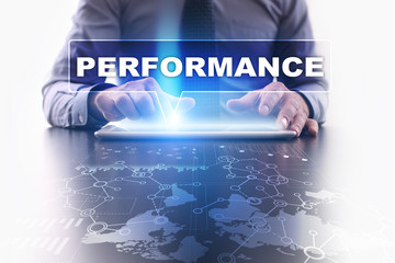 Businessman is using tablet pc, pressing on virtual screen and selecting performance.