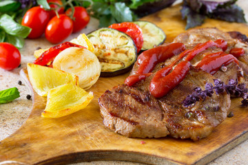 Roast beef or pork with sauce and grilled autumn vegetables: pep