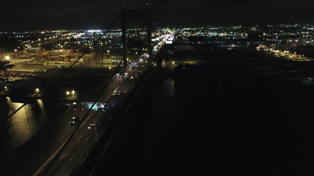 Aerial Footage Heading West over Walt Whitman Bridge Towards Philadelphia PA at Night