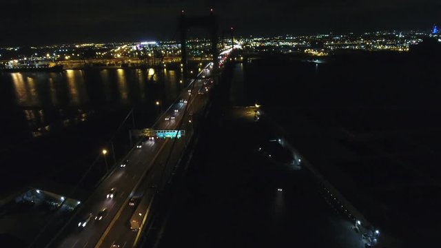 Aerial Footage Heading West over Walt Whitman Bridge Towards Philadelphia PA at Night