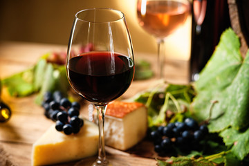Wine glass, grapes and cheese 