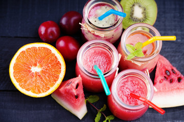 Jars with smoothies and fruits 