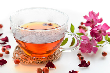 tea of rose hips in white background