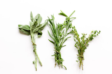 sage, rosemary, thyme - tufts of herbs white background - Powered by Adobe