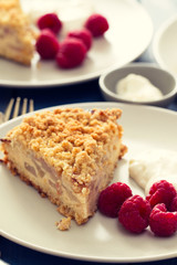 cake with berries on dish on wooden background