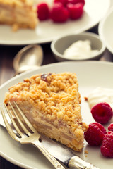 cake with berries on dish on wooden background