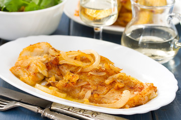 cod fish with potato on white plate