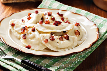 Dumplings with meat or cabbage and mushroom or cheese seasoned fried bacon