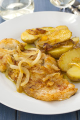 cod fish with potato on white plate