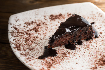 Chocolate piece of cake on plate.