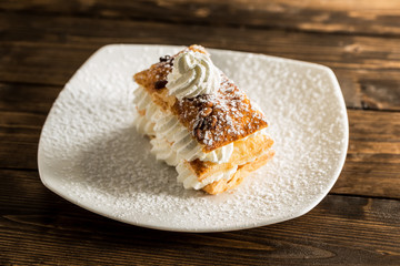 Creamy desert on white plate.