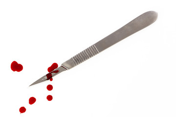scalpel on the white background with  blood splash