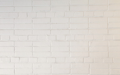 Fototapeta na wymiar Background of the white brick wall. Bricks are merged with the cement strainer and can be used for background
