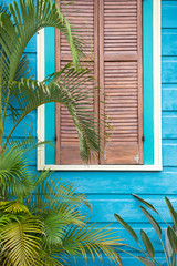 Colorful blue and pink wooden house detail of classical New Orleans shotgun house architecture