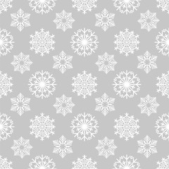 Winter background with frozen snowflakes on grey backdrop. Snowflakes seamless pattern. Vector illustration