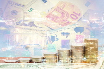 Double exposure of night light in city and rows of coins 