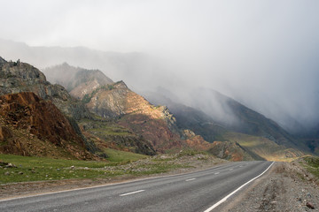 Highland road in the mountains, fog