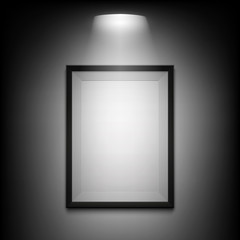 Blank illuminated picture frame on black background