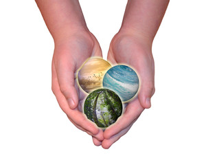 Child hands holding sky, ocean and forest spheres isolated on white background. Conservation, protecting the environment and Earth’s future is in our hands concepts