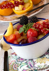Close-up of fresh fruit and different berries in bowl