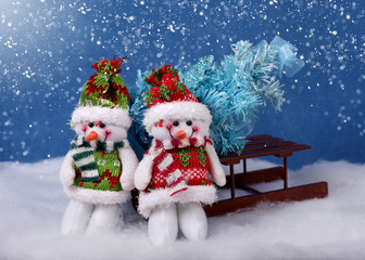 Christmas snowmans and xmas tree and snow. Winter holidays concept 
