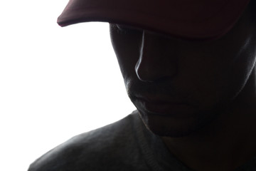 Portrait of a young man in cap, half view