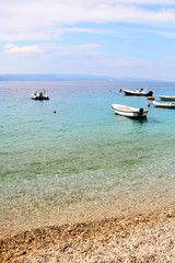 Fototapeta na wymiar Beautiful sea beach with boats