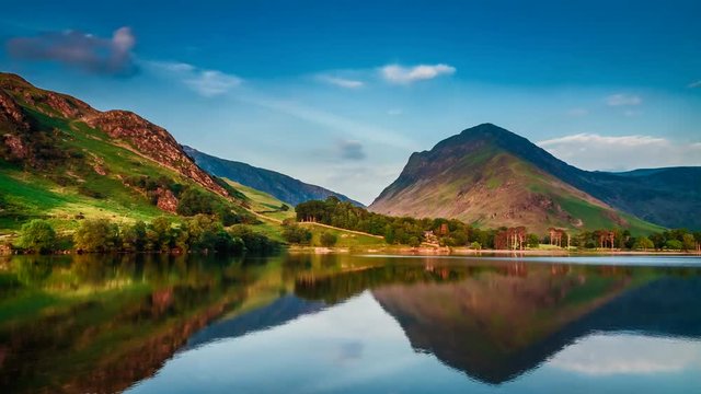 Sunset over the lake and mountains in the Lake District, 4k, timelapse